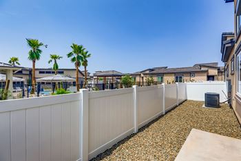 apartments balcony and yard with palm trees  at Grandstone at Sunrise, Peoria, Arizona
